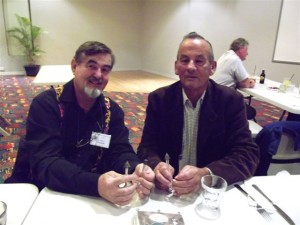 Paul Holland and Jock McDonald viewing Viva's teaspoons
